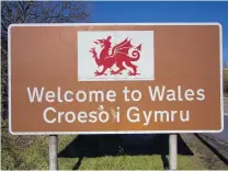  ?? PHOTOS: GETTY IMAGES/ GREGOR RICHARDSON ?? Road signs in Wales (above) must be in English and Welsh. New Zealand (right) has yet to adopt that policy.