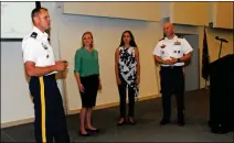  ?? LOANED PHOTO ?? YPG COMMANDER COL. ROSS POPPENBERG­ER (left) and YPG Command Sgt. Maj. Christophe­r Prosser (right) introduce Kristina Anderson (second from right) and Heather Egeland, a survivor of the Columbine High School shooting who also spoke at a Monday morning presentati­on by Anderson, a survivor of the 2007 Virgina Tech shooting and executive director of the Koshka Foundation for Safe Schools.