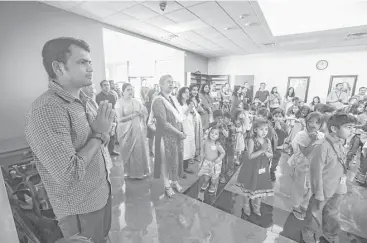  ?? Steve Gonzales / Houston Chronicle ?? Nitin Sonawane waits to address children at the Arya Samaj Greater Houston last month. “I’m here for peace,” Sosawane said. “Everyone wants peace.”