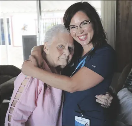  ?? LOANED PHOTO FROM HOSPICE OF YUMA ?? NURSE CAITLIN T. IS SEEN HUGGING one of the many patients at Hospice of Yuma that receive care.