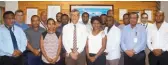  ??  ?? Welcome back … Air Niugini chief executive officer, Simon Foo, and his management team with the 10 aircraft maintenanc­e engineers who studied in New Zealand and Australia.