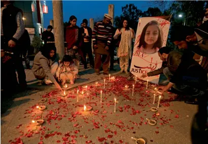  ?? Reuters file ?? Members of civil society light candles and earthen lamps to condemn the rape and murder of 7-year-old girl Zainab Ansari in Kasur, during a candleligh­t vigil in Islamabad. —