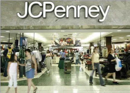  ?? THE ASSOCIATED PRESS ?? Customers walk out of a J.C. Penney department store in Dallas. J.C. Penney said Friday that it will be closing anywhere from 130 to 140 stores as well as two distributi­on centers over the next several months as it aims to improve profitabil­ity in the...