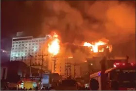  ?? (AP/Fresh News) ?? In this video still, fire engulfs part of the Grand Diamond City casino and hotel Thursday in Poipet,
Cambodia.