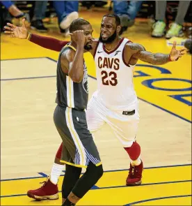  ?? JANE TYSKA / BAY AREA NEWS GROUP ?? Cleveland’s LeBron James (right, with Golden State’s Kevin Durant) shows he disagrees after he was called for a technical foul Sunday in Game 2.