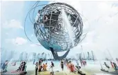  ?? JOHANNES EISELE/GETTY-AFP ?? People at Flushing Meadows Park in New York’s borough of Queens try to stay cool on Sunday.