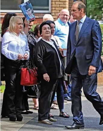  ??  ?? Determined: Jenny Hicks, in a white blouse, locks eyes with Norman Bettison yesterday