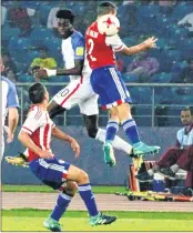  ?? PTI ?? USA's and Paraguay's (Red and blue) plyaers vie for the ball during the FIFA U-17 World Cup football match in New Delhi on Monday.