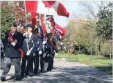  ?? KRIS DUBE
THE WELLAND TRIBUNE ?? Sergeant at Arms Gerard Thibault leads the colour party at Sunday’s Remembranc­e Day ceremony in Welland.