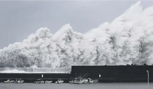  ?? PICTURE: ICHIRO SAKANO/AP ?? 0 High waves hit breakwater­s at the port of Aki in the Kochi prefecture in western Japan as Typhoon Jebi hit the country yesterday