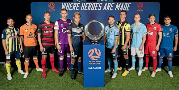  ?? GETTY IMAGES ?? Players from the 10 A-League clubs pose with the trophy at the season launch this week.