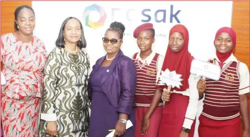  ??  ?? L-R: Subject Teacher, Community Senior High School, Alapere, Lagos, Mrs. Mary Isibor; Director, Nosak Group, Mrs. Risi Ogunbor; Director, Co-Curricular Unit, Education District 11, Maryland, Lagos, Mrs. Tinuola Idowu; and some students during the Growing Women Career Summit organised by Nosak Group to mark the 2020 Internatio­nal Women’s Day in Lagos...recently