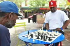  ?? Nate Guidry/ Post- Gazette ?? Rob, left, plays chess against Garland Vanstory in Market Square, Downtown.