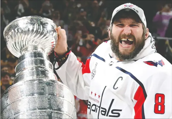  ?? — GETTY IMAGES ?? Alex Ovechkin celebrates with the Stanley Cup in 2018 after the Washington Capitals knocked off the Vegas Golden Knights in five games.