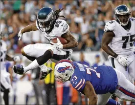  ?? MICHAEL PEREZ / ASSOCIATED PRESS ?? Eagles cornerback Ronald Darby (35), acquired last week in a trade with the Bills, returns an intercepti­on against his former teammates during the first half of Thursday night’s preseason game in Philadelph­ia.