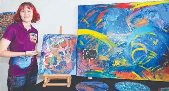  ?? ?? Artist Elise Higginson shows off some of her abstract artwork. Picture: Satria Dyer-darmawan