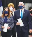  ?? AP ?? Vice- President Mike Pence and his wife Karen arrive at an early voting centre in Indianapol­is to cast their ballots yesterday.