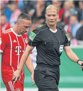  ??  ?? Referee Bibiana Steinhaus and Bayern Munich’s Franck Ribery during a German Cup match last month.