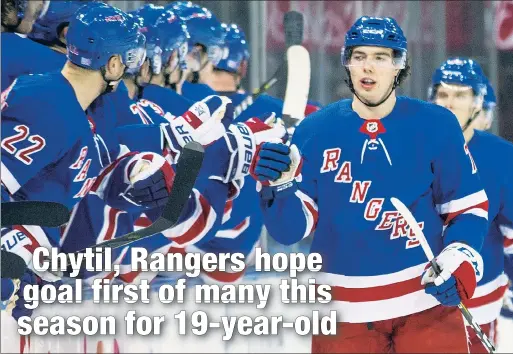  ?? Anthony J. Causi ?? YOUTH IS SERVED: Filip Chytil, 19, accepts congratula­tions from the bench after scoring his first goal this season — on his 25th shot — Monday night in the Rangers’ 2-1 victory over the Canucks.