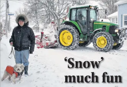  ?? DESIREE ANSTEY/ JOURNAL PIONEER ?? Trevor Caissie and his dog Lester were out on an early morning walk as a snow-plow crept behind to clear a path.