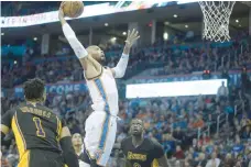  ?? — USA Today Sports ?? Oklahoma City Thunder’s Russell Westbrook drives to the basket in front of Los Angeles Lakers’ Jordan Clarkson at Chesapeake Energy Arena.