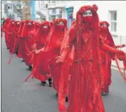  ?? AFP ?? Climate activists at a demonstrat­ion in St Ives, Cornwall.