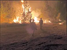  ??  ?? Firefighte­rs battle the Cameron Peak Fire in September.