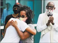  ?? Matthew Brown / Hearst Connecticu­t Media ?? Valerie Jaddo, mother of Steven Barrier, hugs Kyla Johns following her impassiona­te speech to hundreds participat­ing in a March for Justice for Steven Barrier.