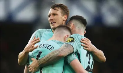  ?? ?? The 6ft 7in Dan Burn, pictured celebratin­g Brighton’s 3-2 victory at Everton this month, could be on the move. Photograph: Chris Brunskill/ Getty Images