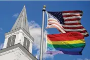  ?? Charlie Riedel/Associated Press file photo ?? A gay pride rainbow flag flies at Asbury United Methodist Church in Prairie Village, Kan., in 2019. A quarter of U.S. congregati­ons are leaving UMC.