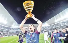  ??  ?? Paris Saint-Germain’s Uruguayan forward Edinson Cavani holds his trophy after winning the French League Cup final football match between Monaco (ASM) and Paris Saint-Germain (PSG) at The Matmut Atlantique Stadium in Bordeaux, southweste­rn France on...