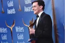  ?? ALBERTO E. RODRIGUEZ/GETTY IMAGES FOR WGAW ?? Arrival screenwrit­er Eric Heisserer took home the trophy for adapted screenplay at the Writers Guild Awards on Sunday.