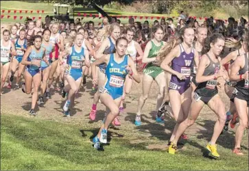  ?? Don Gosley UCLA Athletics ?? ERIKA ADLER, center, was the only Bruin to qualify for the national championsh­ips in Madison, Wis.