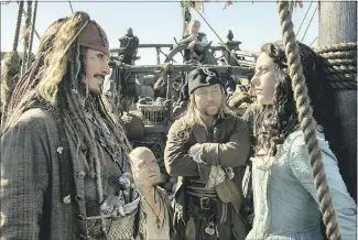  ?? PETER MOUNTAIN/ DISNEY ?? Johnny Depp plays Jack Sparrow, left, and Kaya Scodelario plays Carina Smyth in “Pirates of the Caribbean: