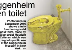  ?? AFP ?? Photo taken in September 2016 shows a fully functionin­g solid gold toilet, made by Italian artist Maurizio Cattelan, which was going into public use at the Guggenheim Museum in New York.