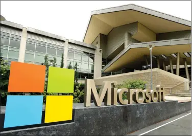  ?? (AP) ?? The Microsoft Corp. logo is displayed outside the Microsoft Visitor Center in Redmond, Wash. The company is in the process of rebuilding its headquarte­rs campus.