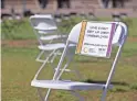  ?? SEAN LOGAN/THE REPUBLIC ?? A chair with a sign for unemployed live event workers is seen on Sept. 22, 2020, at Tempe Beach Park. A rally was held to show the impact of COVID-19 on the live events industry and its workers.