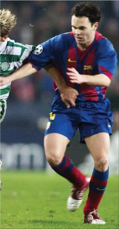  ?? Picture: Getty ?? Stiliyan Petrov battles with Andres Iniesta in a game Celtic drew 1-1 at the Nou Camp in 2004