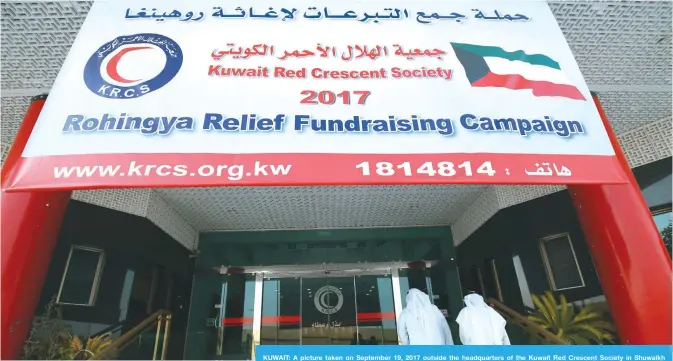  ??  ?? KUWAIT: A picture taken on September 19, 2017 outside the headquarte­rs of the Kuwait Red Crescent Society in Shuwaikh shows a large banner for a fundraisin­g campaign for the relief of Myanmar’s Rohingya Muslims. — Photo Yasser Al-Zayyat