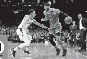  ??  ?? Landry Shamet (20) of the LA Clippers defends Jayson Tatum (0) of the Boston Celtics