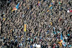  ?? DAVID RAMOS/GETTY IMAGES ?? Thousands of citizens gather in Plaza Universita­t during a regional general strike to protest against the violence that marred Sunday’s referendum vote on Tuesday in Barcelona, Spain.