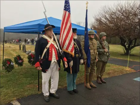  ?? ERIC DEVLIN - FOR MEDIANEWS GROUP ?? Reenactors (from left) John Bellenzeni, Richard Gehlhaus, Chuck Faust and EJ Lennox, served as the color guard during the wreath laying ceremony at Wentz’s United Church of Christ in Lansdale Saturday.