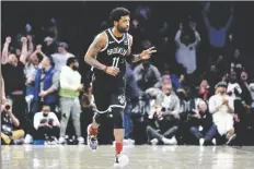  ?? SETH WENIG/ AP ?? Brooklyn Nets’ Kyrie Irving reacts after hitting a basket against the Cleveland Cavaliers during the first half of the opening basketball game of the NBA play-in tournament Tuesday in New York.