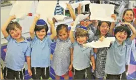  ??  ?? Putting in their papers: Sacks Morasha pupils show waves of enthusiasm