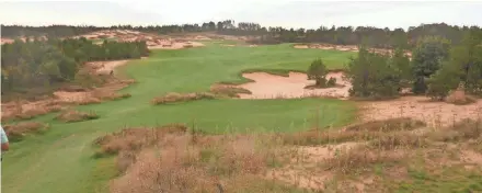  ?? GARY D'AMATO / JOURNAL SENTINEL ?? A huge lake once covered the area at Sand Valley in prehistori­c times and left sand deposits that are 200 feet deep. Sand Valley (with its clubhouse shown below) was named best new course of 2017 by Golf Digest.