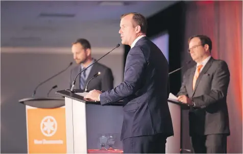  ?? PHOTOS: BRANDON HARDER ?? NDP candidates Ryan Meili, left, and Trent Wotherspoo­n, centre, faced off Saturday before party delegates.