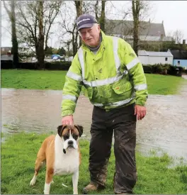 ??  ?? John Daly and Suzy checking out the flooding in Kanturk Town Park on Tuesday. Photo by Sheila Fitzgerald