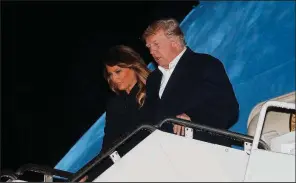  ?? AP/PABLO MARTINEZ MONSIVAIS ?? President Donald Trump and first lady Melania Trump depart Air Force One at Andrews Air Force Base, Md., on Sunday after returning from the G-20 summit in Argentina.