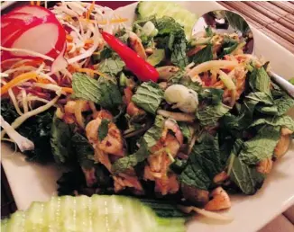  ?? PHOTOS: PETER HUM/OTTAWA CITIZEN ?? The enticing Yum Gai Yang at Thai Flame ticks off all the boxes — meaty, salty, sour, sweet, herbaceous, fresh, crunchy.