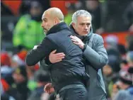  ?? CARL RECINE / ACTION IMAGES VIA REUTERS ?? Pep Guardiola (left) and Jose Mourinho share a frosty embrace after Sunday’s derby.